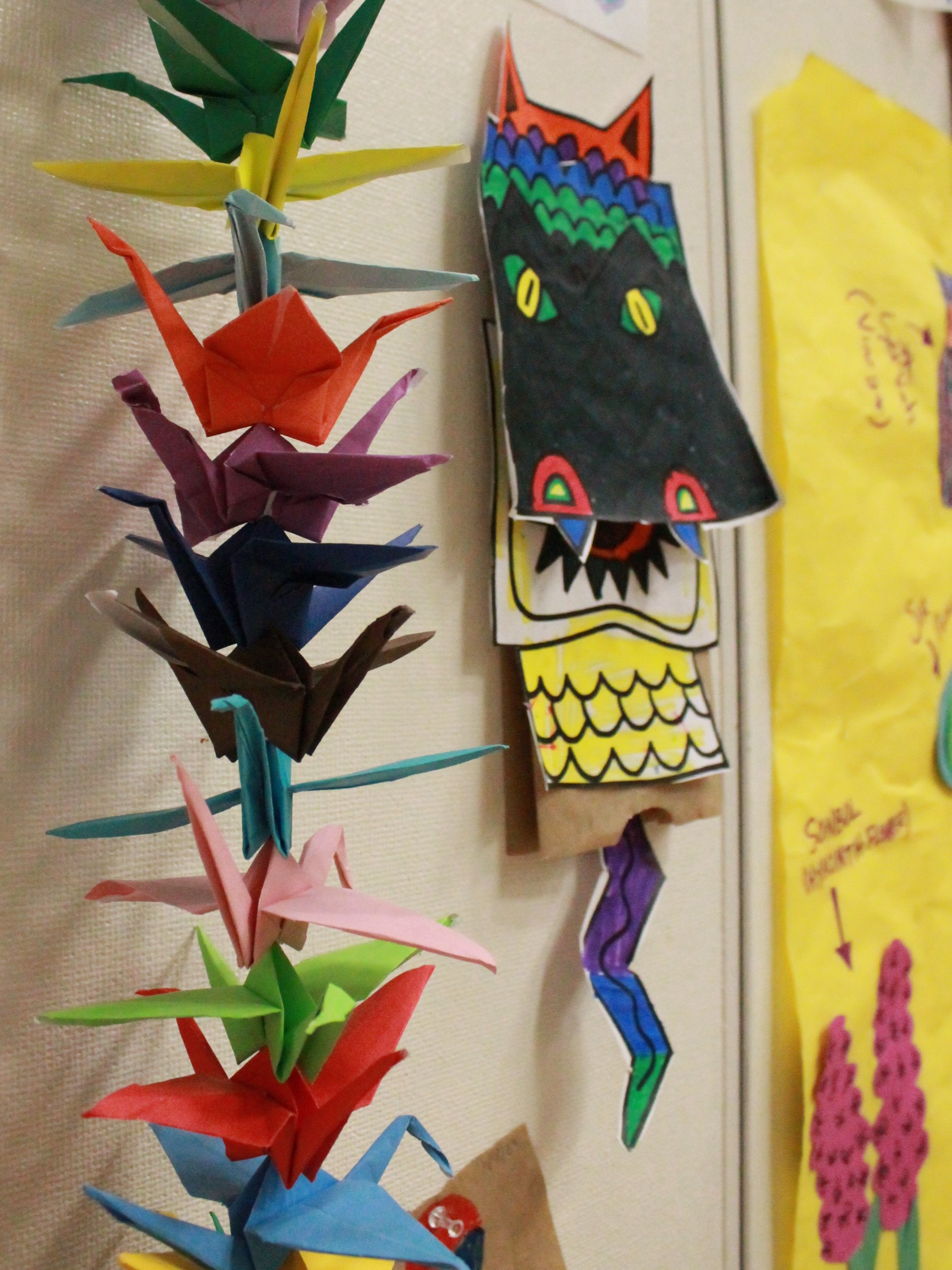 Colorful paper crafts hanging on a wall at an Asian Heritage festival