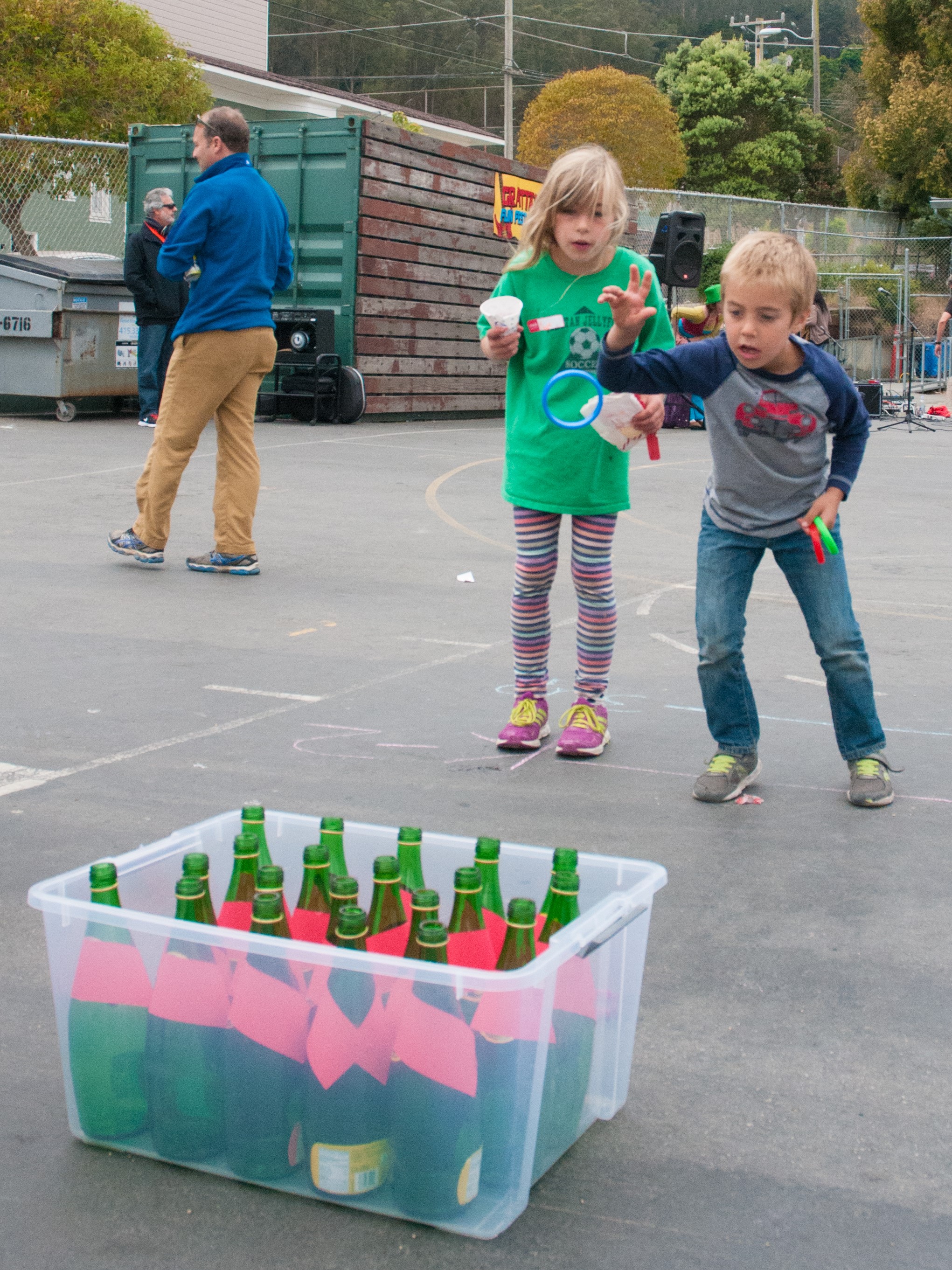 Children playing ring toss at an outdoor school festival