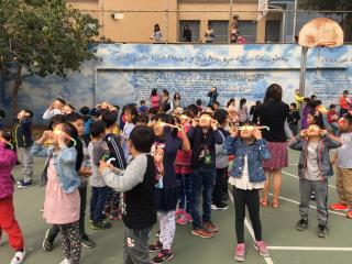 Gordon Lau students celebrating solar eclipse