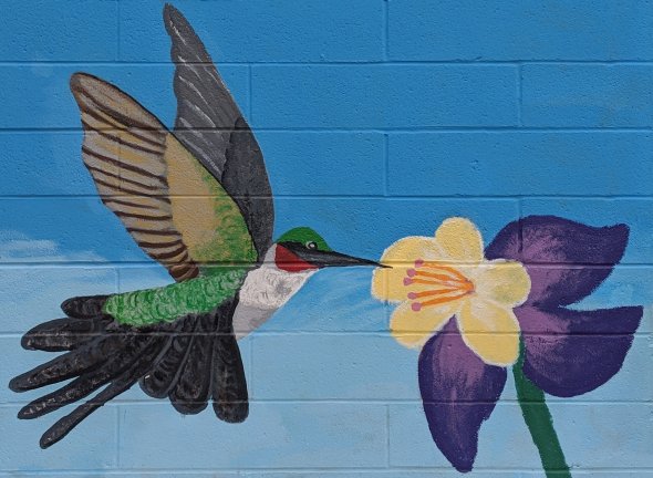 Mural painting of hummingbird and flower